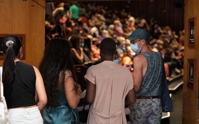 Take Five Audience members entering the theater.