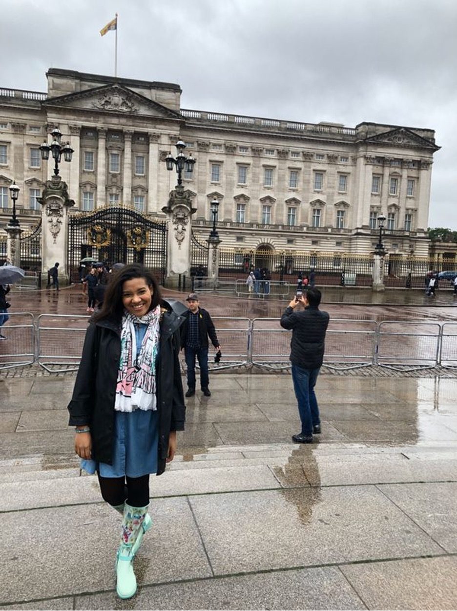 Shereen Pimentel standing in front of Buckingham Palace