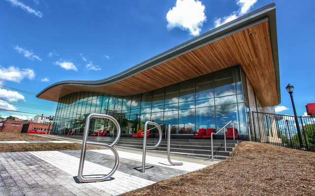 East Boston Branch Library A view of the East Boston Branch Library with a bike rack shaped like the letters B-P-L in front.