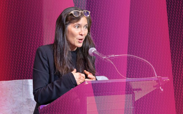 Diane Paulus speaks at a podium.